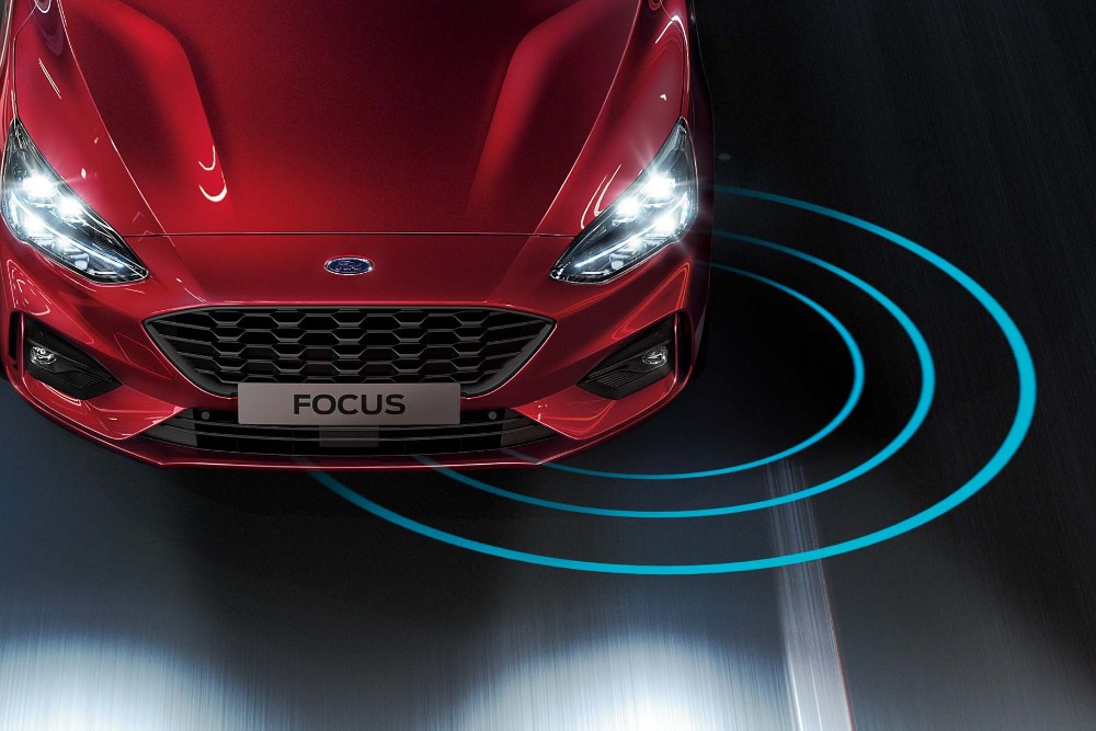 Red Ford Focus on the road